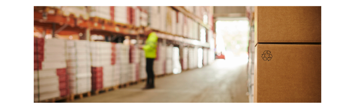 man with yellow jacket inspecting warehouse stocks representing AtlasIED is open for business